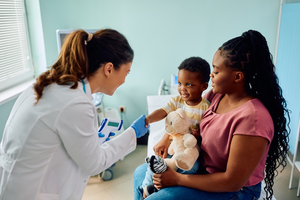 Parent preparing child for a pediatrician visit.