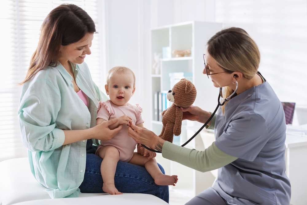 Pediatrician tracking childhood milestones.
